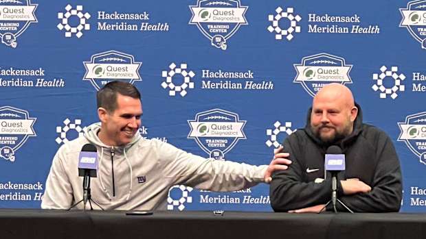 Giants general manager Joe Schoen jokes with head coach Brian Daboll during Monday's end-of-season joint news conference.
