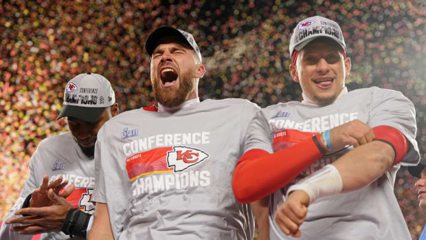 Jan 29, 2023; Kansas City, Missouri, USA; Kansas City Chiefs tight end Travis Kelce (left) and Kansas City Chiefs quarterback Patrick Mahomes (15) celebrate after winning the AFC Championship game at GEHA Field against the Cincinnati Bengals at Arrowhead Stadium. Mandatory Credit: Jay Biggerstaff-USA TODAY Sports