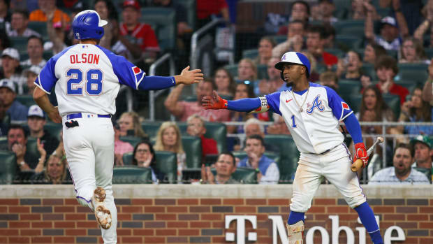 May 6, 2023; Atlanta, Georgia, USA; Atlanta Braves first baseman Matt Olson (28) celebrates after scoring with second baseman Ozzie Albies (1) against the Baltimore Orioles in the fourth inning at Truist Park.