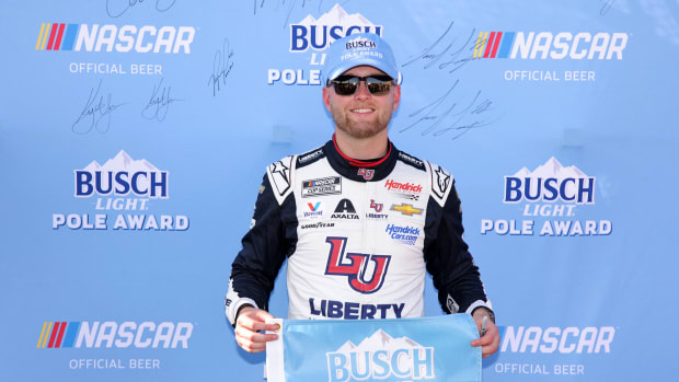 William Byron celebrates after winning the pole award following Saturday's qualifying for Sunday's NASCAR Cup Series Advent Health 400 at Kansas Speedway. (Photo by Jonathan Bachman/Getty Images)