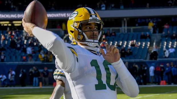 Packers quarterback Jordan Love throws a pass during warmups before a game.