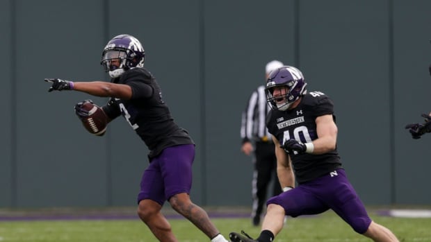Northwestern defensive back Cameron Mitchell (2) celebrates a stop during the first quarter of an NCAA college football game, Saturday, Nov. 20, 2021 at Wrigley Field in Chicago. Cfb Purdue Vs Northwestern