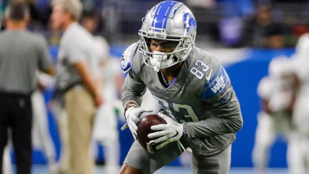 Lions wide receiver Stanley Berryhill warms up before a game in full uniform.