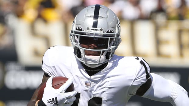 Former Raiders wide receiver Henry Ruggs III runs with the ball during a game in 2021.