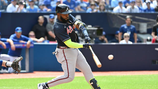 May 13, 2023; Toronto, Ontario, CAN; Atlanta Braves designated hitter Marcell Ozuna (20) hits a two run home run against the Toronto Blue Jays in the second inning at Rogers Centre.