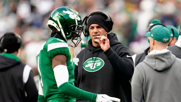 Head coach Robert Saleh interacts with Sauce Gardner on the sideline