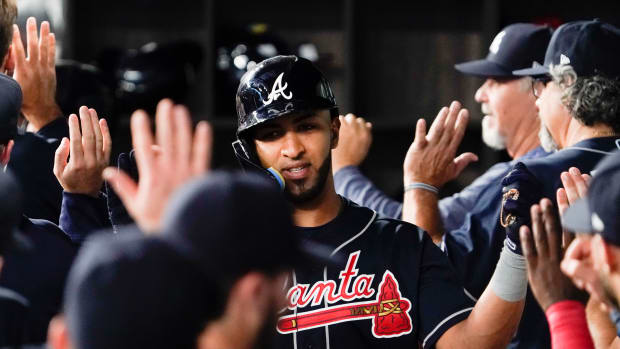 May 17, 2023; Arlington, Texas, USA; Atlanta Braves left fielder Eddie Rosario (8) is greet in the dugout after hitting a two-run home run during the second inning against the Texas Rangers at Globe Life Field. Mandatory Credit: Raymond Carlin III-USA TODAY Sports