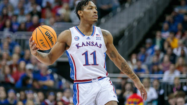 Mar 11, 2023; Kansas City, MO, USA; Kansas Jayhawks guard MJ Rice (11) sets the play during the first half against the Texas Longhornsat T-Mobile Center. Mandatory Credit: William Purnell-USA TODAY Sports