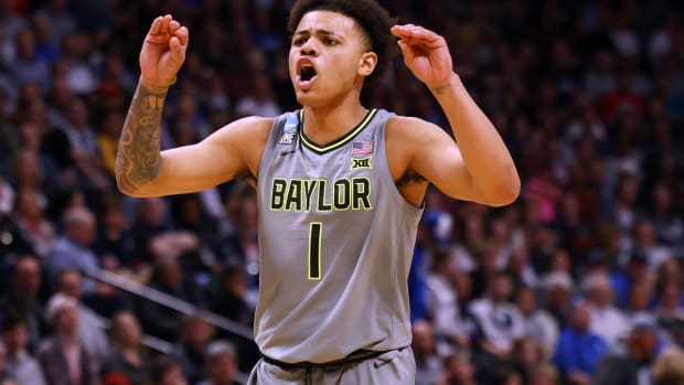 Baylor Bears guard Keyonte George (1) reacts in the second half against the Creighton Bluejays at Ball Arena.