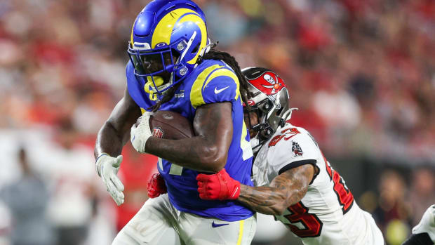 Nov 6, 2022; Tampa, Florida, USA; Los Angeles Rams running back Darrell Henderson Jr. (27) is tackled by Tampa Bay Buccaneers cornerback Sean Murphy-Bunting (23) in the third quarter at Raymond James Stadium. Mandatory Credit: Nathan Ray Seebeck-USA TODAY Sports