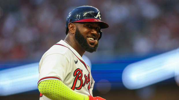 May 25, 2023; Atlanta, Georgia, USA; Atlanta Braves designated hitter Marcell Ozuna (20) reacts on third base against the Philadelphia Phillies in the fourth inning at Truist Park.