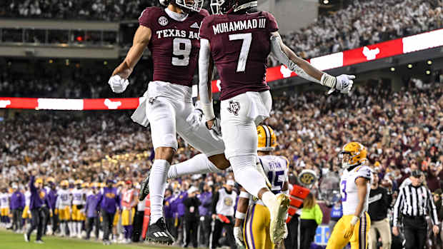 Texas A&M football players celebrate a touchdown.