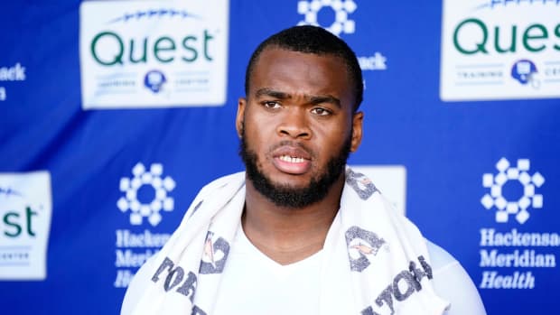 New York Giants offensive tackle Evan Neal talks to reporters after the organized team activities (OTA's) at the Giants training center on Wednesday, May 31, 2023, in East Rutherford.