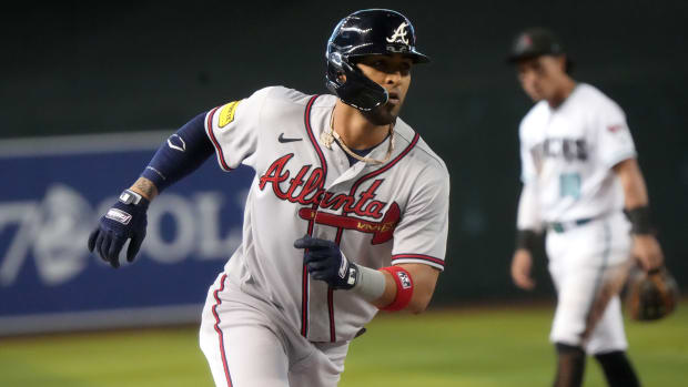 Jun 4, 2023; Phoenix, AZ, USA; Atlanta Braves' Eddie Rosario (8) rounds third base after his 9th inning grand slam against the Arizona Diamondbacks at Chase Field. Mandatory Credit: Joseph Rondone-USA TODAY Sports