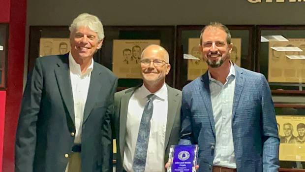 John and Brodie Croyle presented the ASWA Presidents' Award by Ben Thomas of AL.com