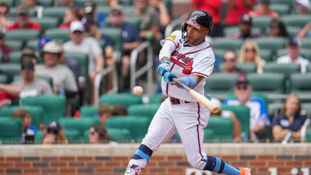 Jun 18, 2023; Cumberland, Georgia, USA; Atlanta Braves left fielder Eddie Rosario (8) hits a three run home run Colorado Rockies during the second inning at Truist Park.