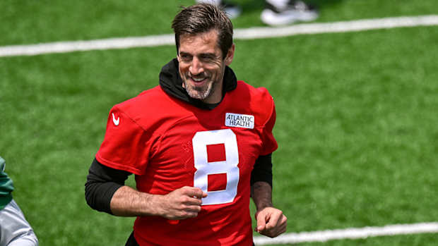Jets quarterback Aaron Rodgers (8) warms up during OTA s at Atlantic Health Jets Training Center.