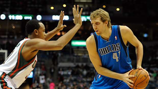 Milwaukee Bucks forward John Henson (31) guards Dallas Mavericks forward Dirk Nowitzki (41)