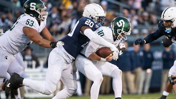 Penn State defensive end Adisa Isaac sacks Michigan State quarterback Payton Thorne.