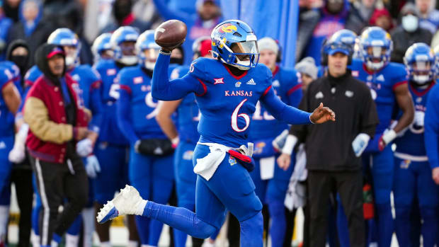 Nov 19, 2022; Lawrence, Kansas, USA; Kansas Jayhawks quarterback Jalon Daniels (6) throws a pass during the first half against the Texas Longhorns at David Booth Kansas Memorial Stadium. Mandatory Credit: Jay Biggerstaff-USA TODAY Sports