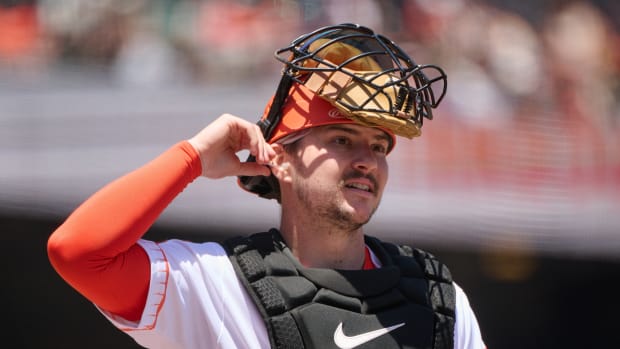 SF Giants catcher Patrick Bailey (14) walks on the field with his catchers mask lifted at Oracle Park (2023)