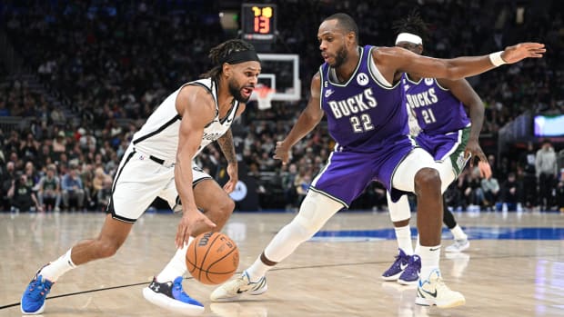 Mar 9, 2023; Milwaukee, Wisconsin, USA; Brooklyn Nets guard Patty Mills (8) drives to the basket against Milwaukee Bucks forward Khris Middleton (22) in the second half at Fiserv Forum.