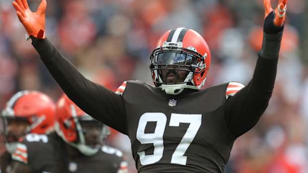 Cleveland Browns defensive tackle Malik Jackson (97) gets the crowd pumped up on third down during the first half of an NFL football game against the Arizona Cardinals at FirstEnergy Stadium, Sunday, Oct. 17, 2021, in Cleveland, Ohio. [Jeff Lange/Beacon Journal] Browns 19