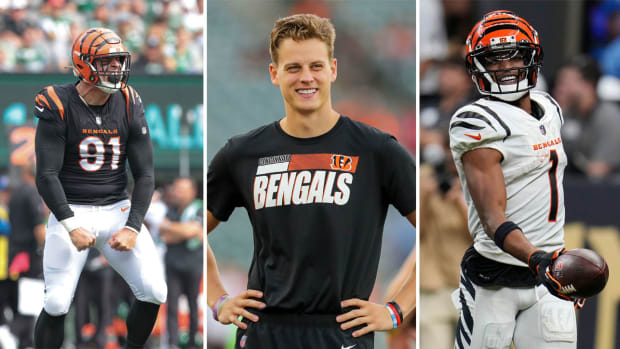 Trey Hendrickson yells as he flexes his arms toward the ground; Joe burrow stands smiling with his hands on his hips; Ja’Marr Chase smiles holding the ball out in one hand