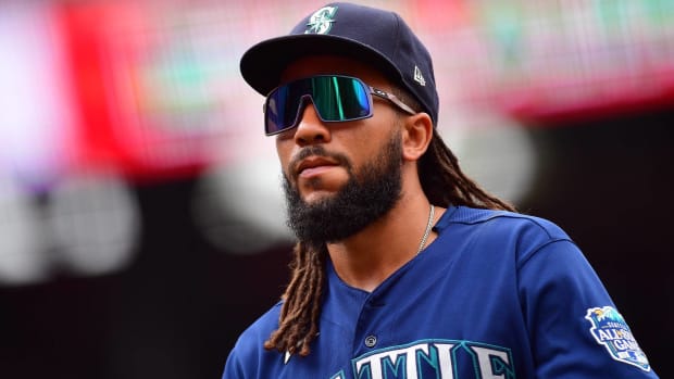 Mariners shortstop J.P. Crawford looks on while in the field during a game.
