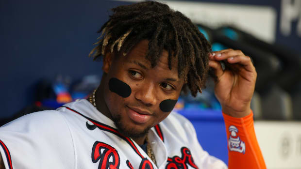 Jul 19, 2023; Atlanta, Georgia, USA; Atlanta Braves right fielder Ronald Acuna Jr. (13) in the dugout against the Arizona Diamondbacks in the fifth inning at Truist Park.