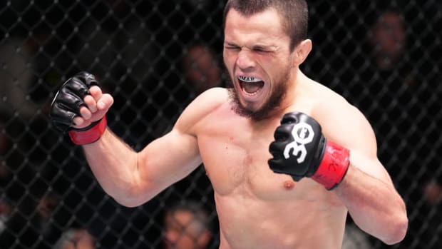 Umar Nurmagomedov celebrates a victory inside the UFC Octagon.