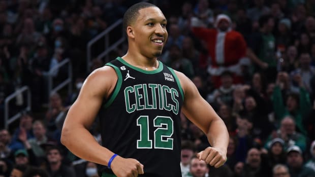 Celtics forward Grant Williams reacts after a basket during the first half against the Minnesota Timberwolves.