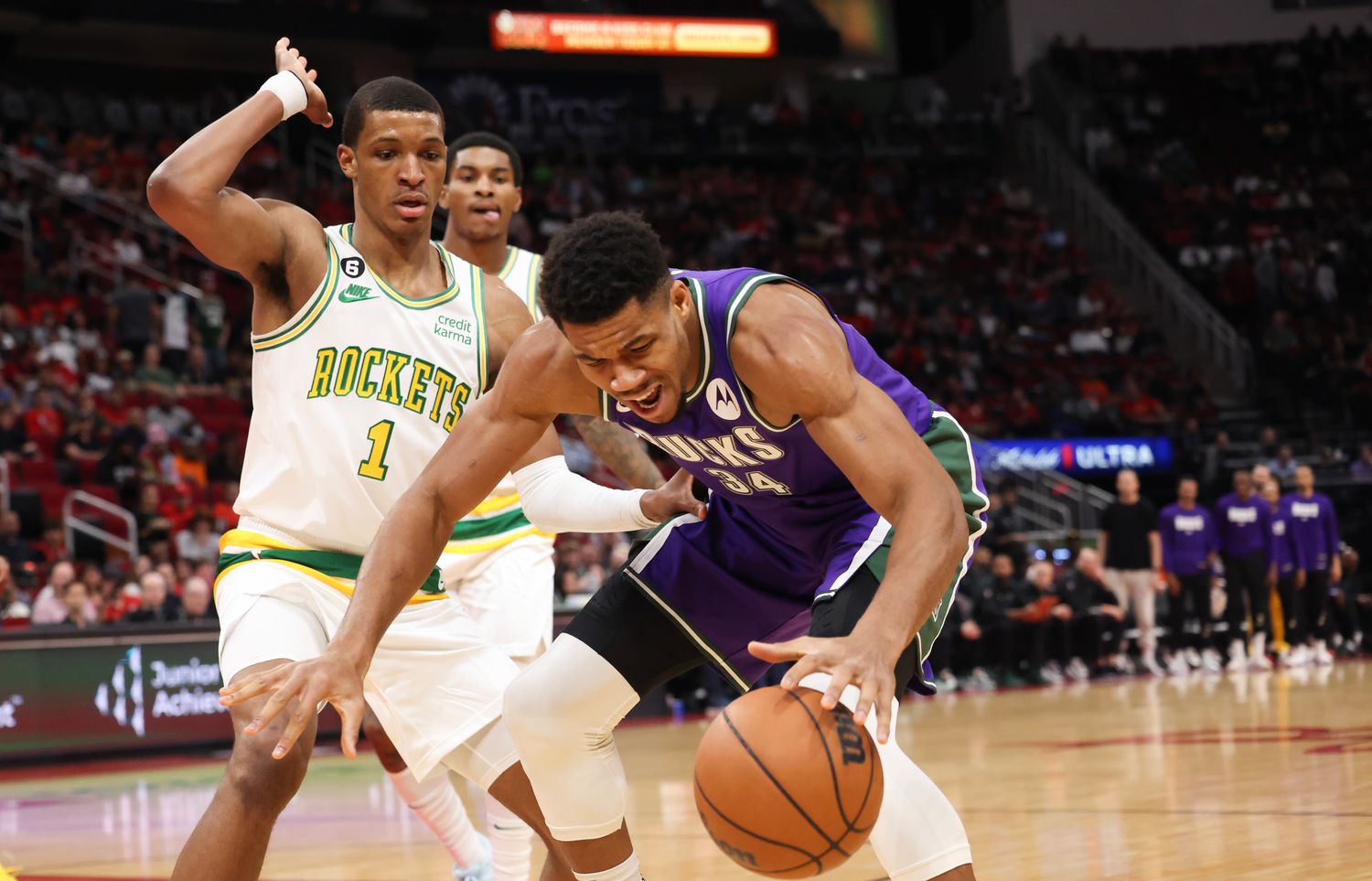 Dec 11, 2022; Houston, Texas, USA; Milwaukee Bucks forward Giannis Antetokounmpo (34) looses his dribble against Houston Rockets forward Jabari Smith Jr. (1) in the first quarter at Toyota Center. Mandatory Credit: Thomas B. Shea-USA TODAY Sports