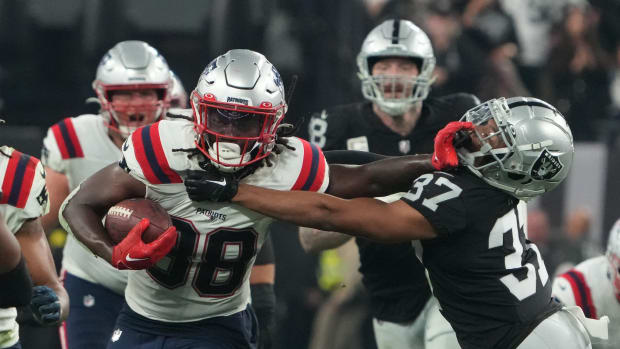 Dec 18, 2022; Paradise, Nevada, USA; New England Patriots running back Rhamondre Stevenson (38) carriies the ball against Las Vegas Raiders cornerback Tyler Hall (37) in the second half at Allegiant Stadium. The Raiders defeated the Patriots 30-24.