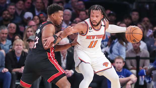 Knicks’ Jalen Brunson posts up Heat’s Kyle Lowry.