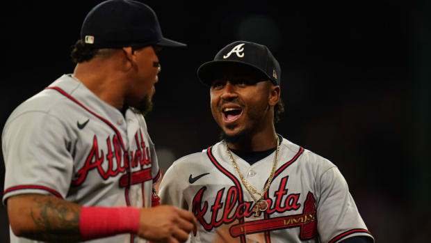Jul 25, 2023; Boston, Massachusetts, USA; Atlanta Braves second baseman Ozzie Albies (1) (right) reacts with shortstop Orlando Arcia (11) after a triple play against the Boston Red Sox in the third inning at Fenway Park.