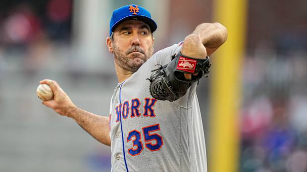 Justin Verlander winds up to throw a pitch