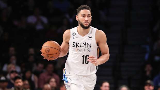 Ben Simmons goes to dribble the ball