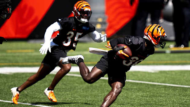 Cincinnati Bengals cornerback DJ Ivey (38) returns an interception during the Cincinnati Bengals fan day practice at Paul Brown Stadium in Cincinnati on Saturday, July 29, 2023.