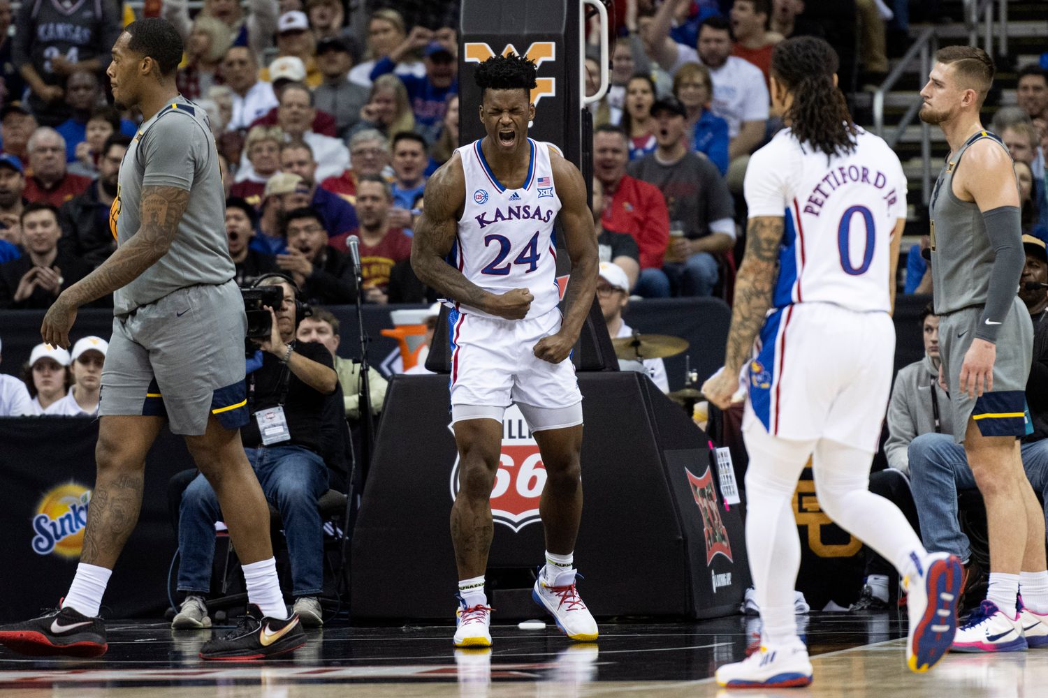 Mar 9, 2023; Kansas City, MO, USA; Kansas Jayhawks forward KJ Adams Jr. (24) celebrates after a play against the West Virginia Mountaineers in the first half at T-Mobile Center.