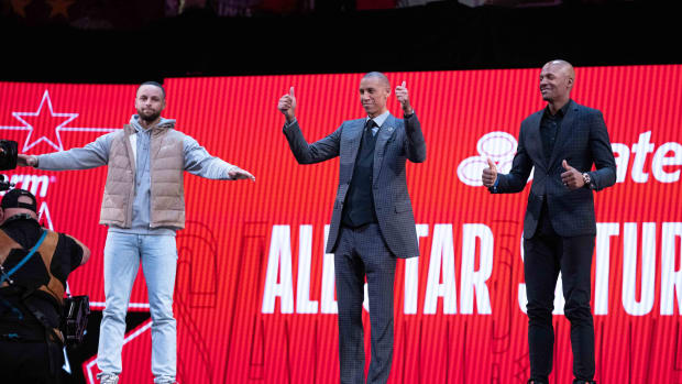 Golden State Warriors guard Stephen Curry (30, left) and NBA great Reggie Miller (center) and NBA great Ray Allen (right)