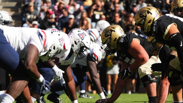 Arizona Wildcats line up across from the Colorado Buffaloes in the first quarter at Folsom Field