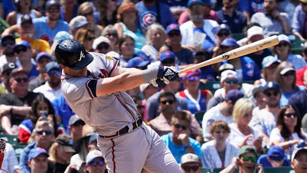 Aug 4, 2023; Chicago, Illinois, USA; Atlanta Braves catcher Sean Murphy (12) hits a two-run home run against the Chicago Cubs during the fourth inning at Wrigley Field.