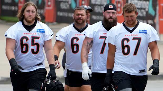 Cincinnati Bengals guard Alex Cappa (65), Cincinnati Bengals center Ted Karras (64), Cincinnati Bengals offensive tackle Jonah Williams (73) and Cincinnati Bengals guard Cordell Volson (67) walk to the fields during NFL training camp practice, Monday, July 31, 2023, in Cincinnati.
