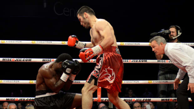 Sep 27, 2014; Montreal, Quebec, Canada; Artur Beterbiev (red trunks) and Tavoris Cloud (black trunks) box during the first round of their light heavyweight NABA championship fight at the Bell Centre.