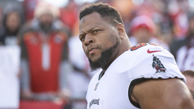 Buccaneers defensive end Ndamukong Suh walks onto the field before the NFC divisional round playoff game against the Rams.