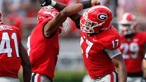 Georgia inside linebacker Nakobe Dean (17) celebrates with Georgia outside linebacker Nolan Smith (4) after getting a sack during the second half of an NCAA college football game between Arkansas and Georgia in Athens, Ga., on Saturday, Oct. 2, 2021. Georgia won 37-0. News Joshua L Jones Syndication Online Athens