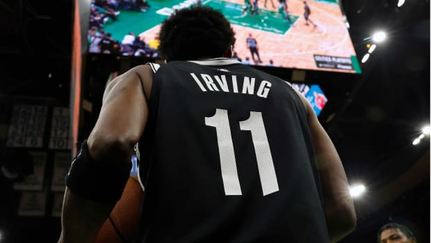 Apr 20, 2022; Boston, Massachusetts, USA; Brooklyn Nets guard Kyrie Irving (11) prepares to inbound the ball as Boston Celtics guard Marcus Smart (36) looks on during the third quarter of game two of the first round of the 2022 NBA playoffs at TD Garden. Mandatory Credit: Winslow Townson-USA TODAY Sports