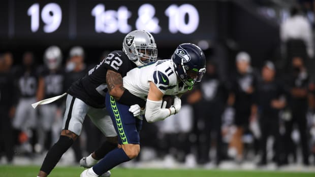 NFL: Seattle Seahawks at Las Vegas Raiders Aug 14, 2021; Paradise, Nevada, USA; Seattle Seahawks wide receiver Cody Thompson (11) is tackled by Las Vegas Raiders defensive back Keisean Nixon (22) during the first quarter at Allegiant Stadium.