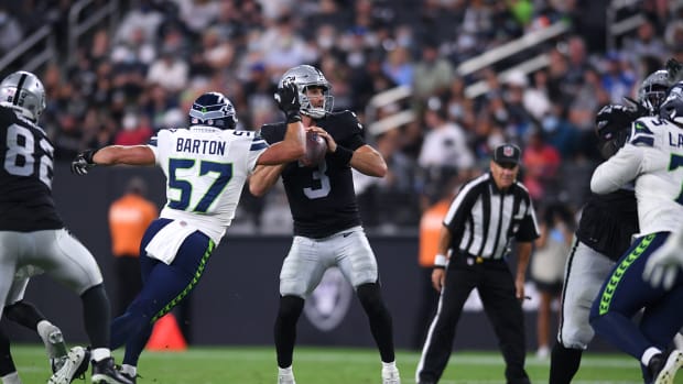 NFL: Seattle Seahawks at Las Vegas Raiders Aug 14, 2021; Paradise, Nevada, USA; Seattle Seahawks linebacker Cody Barton (57) pressures Las Vegas Raiders quarterback Nathan Peterman (3) during the second half at Allegiant Stadium.